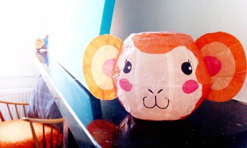 A Japanese paper monkey keeps watch